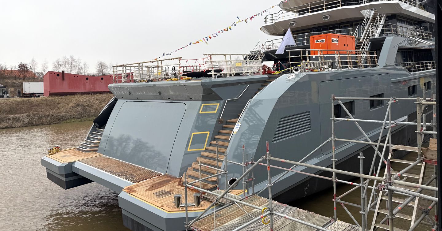 Expedition Yacht Horizon stern at launch with dual stairs and light grey hull