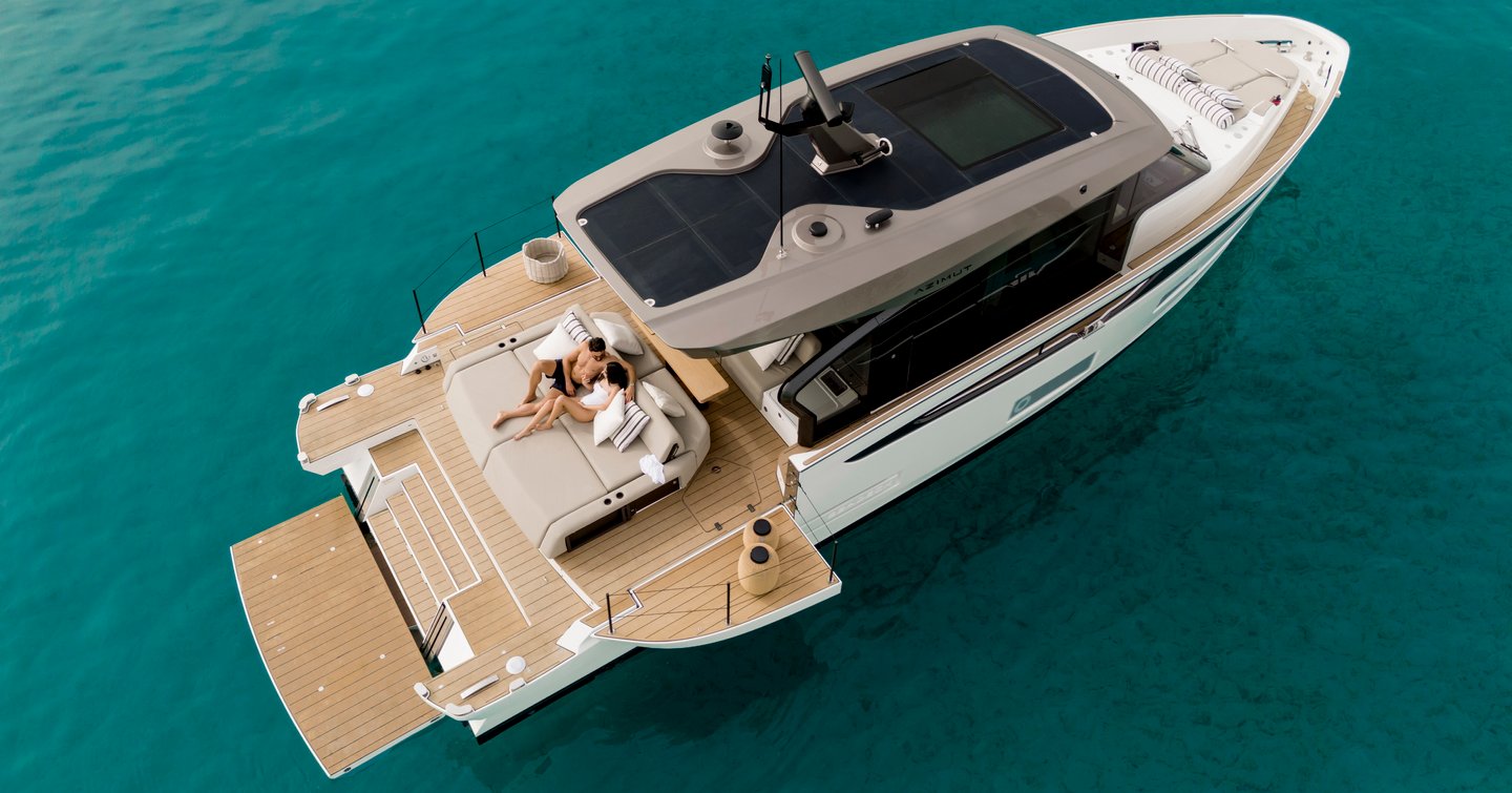 Aerial view of Azimut Seadeck 6 motor yacht at anchor with fold down 'fun island'