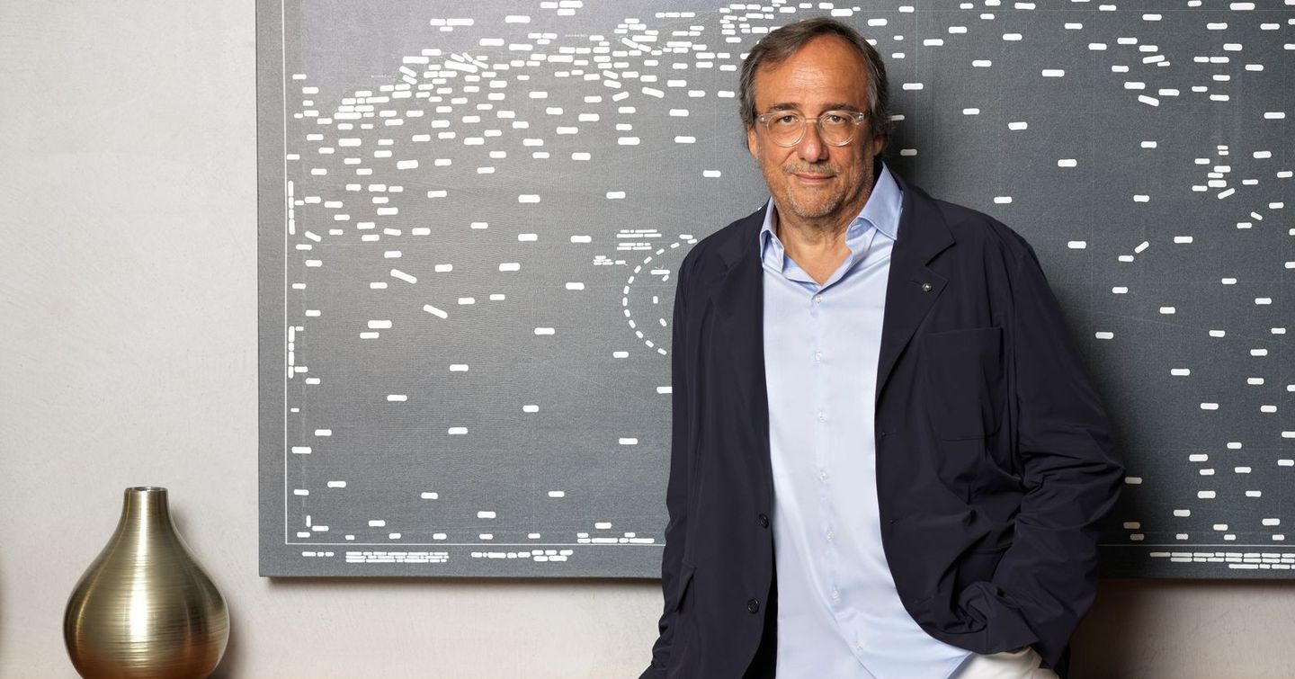 Sanlorenzo's Massimo Perotti leaning on wooden cabinet 