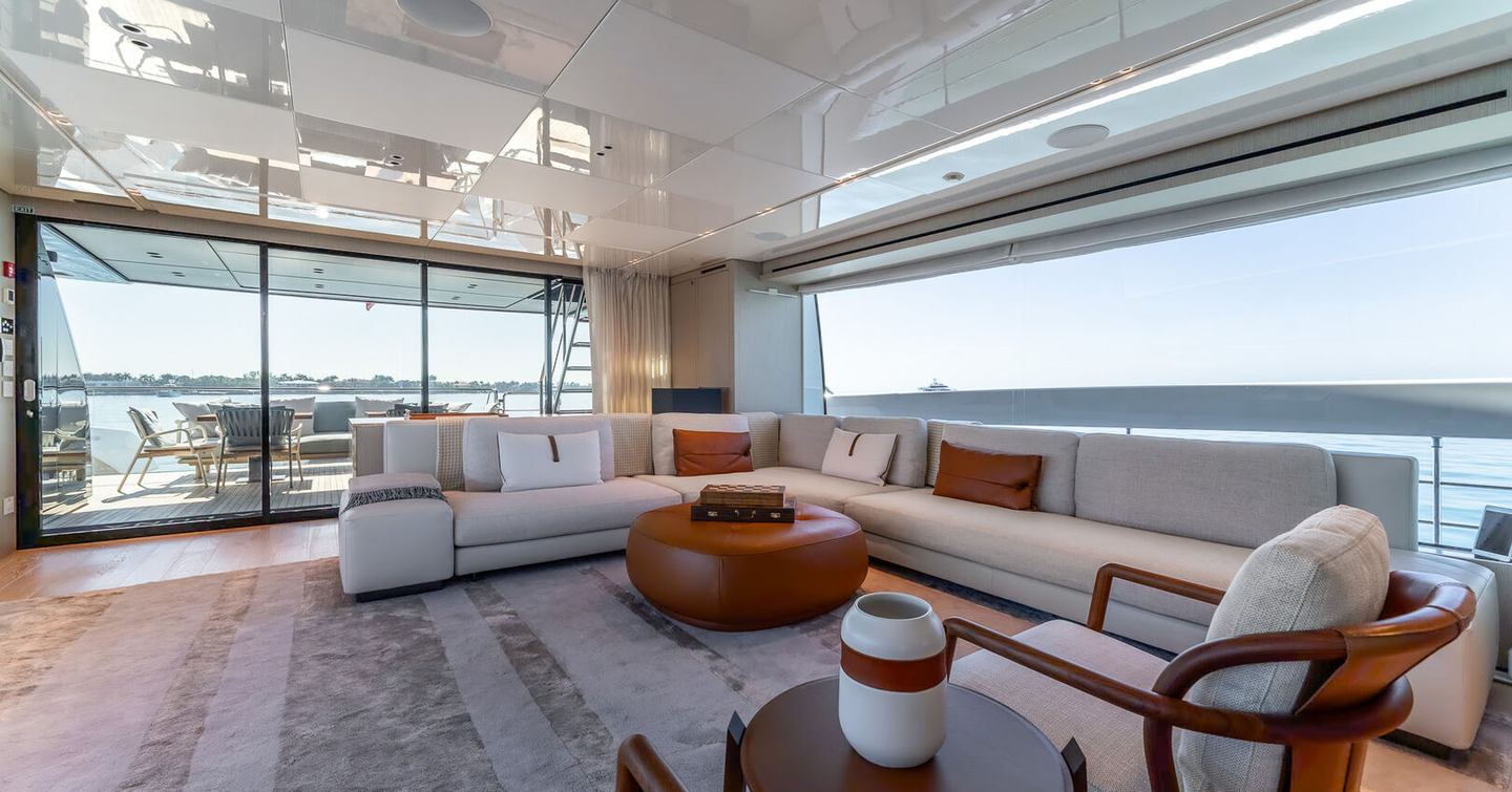 Motor Yacht La Luna interior L-shaped sofa and glass doors 