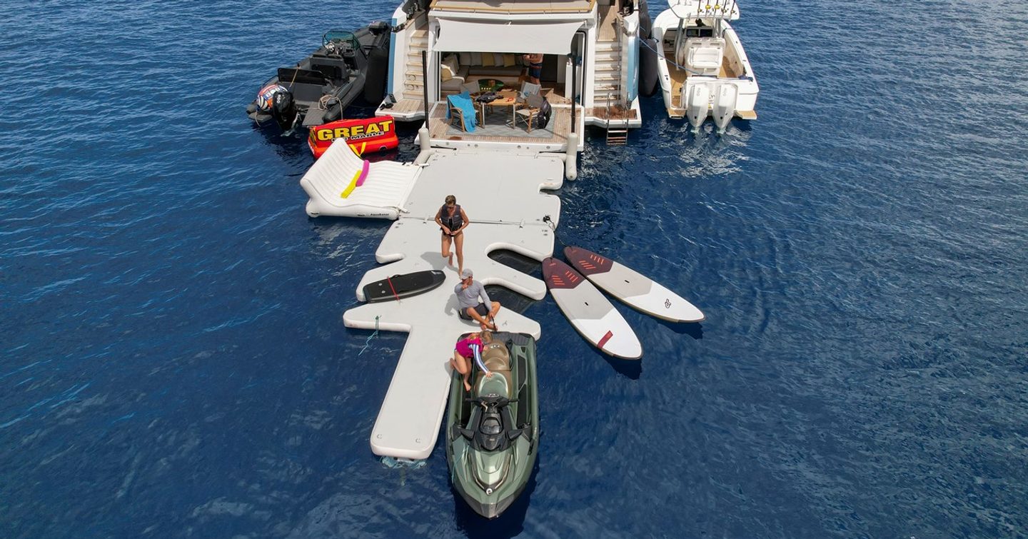 Superyacht Evelyn P's beach club with tenders deployed