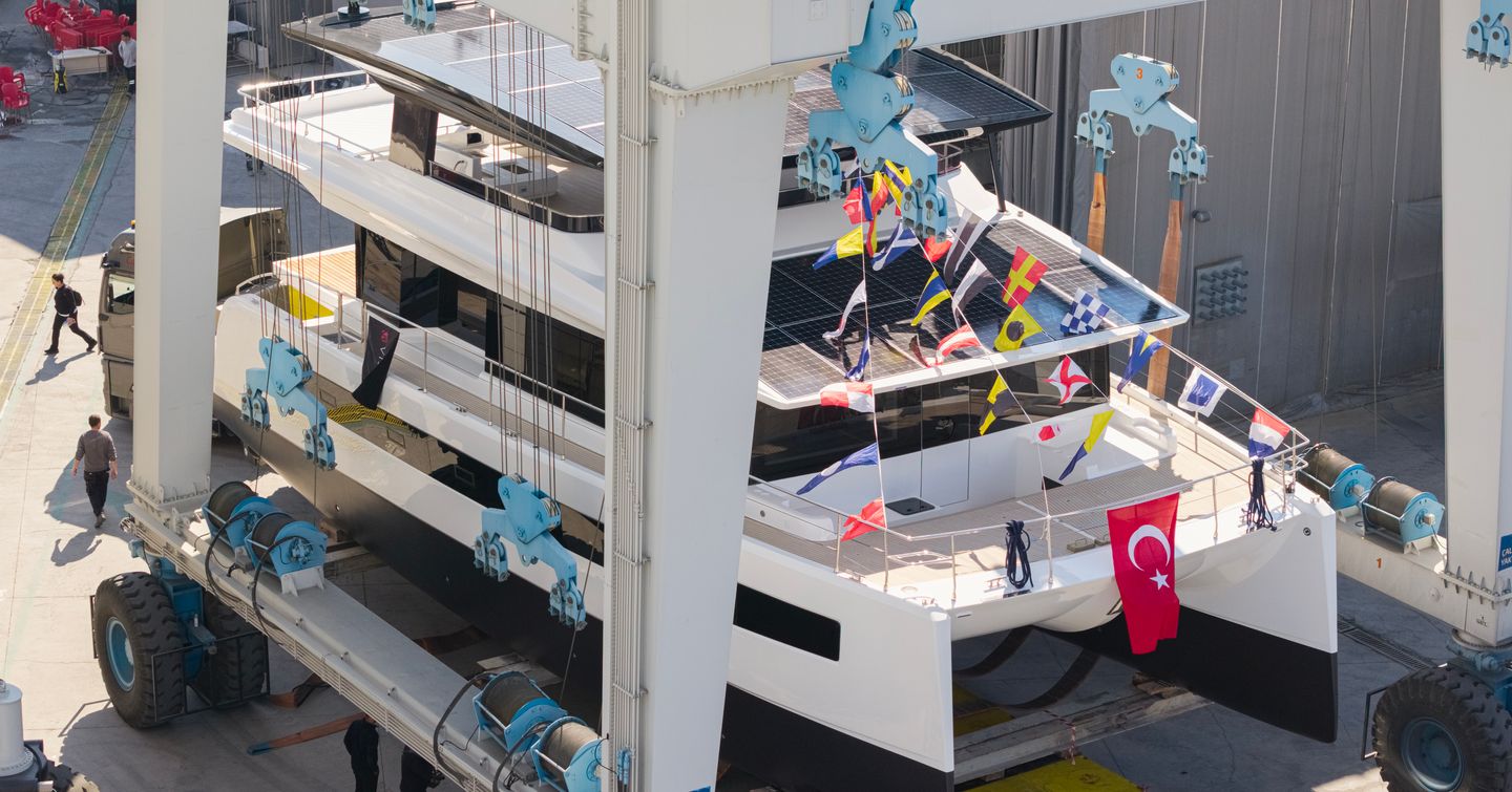 VisionF 65 Catamaran at launch with bunting on foredecks 