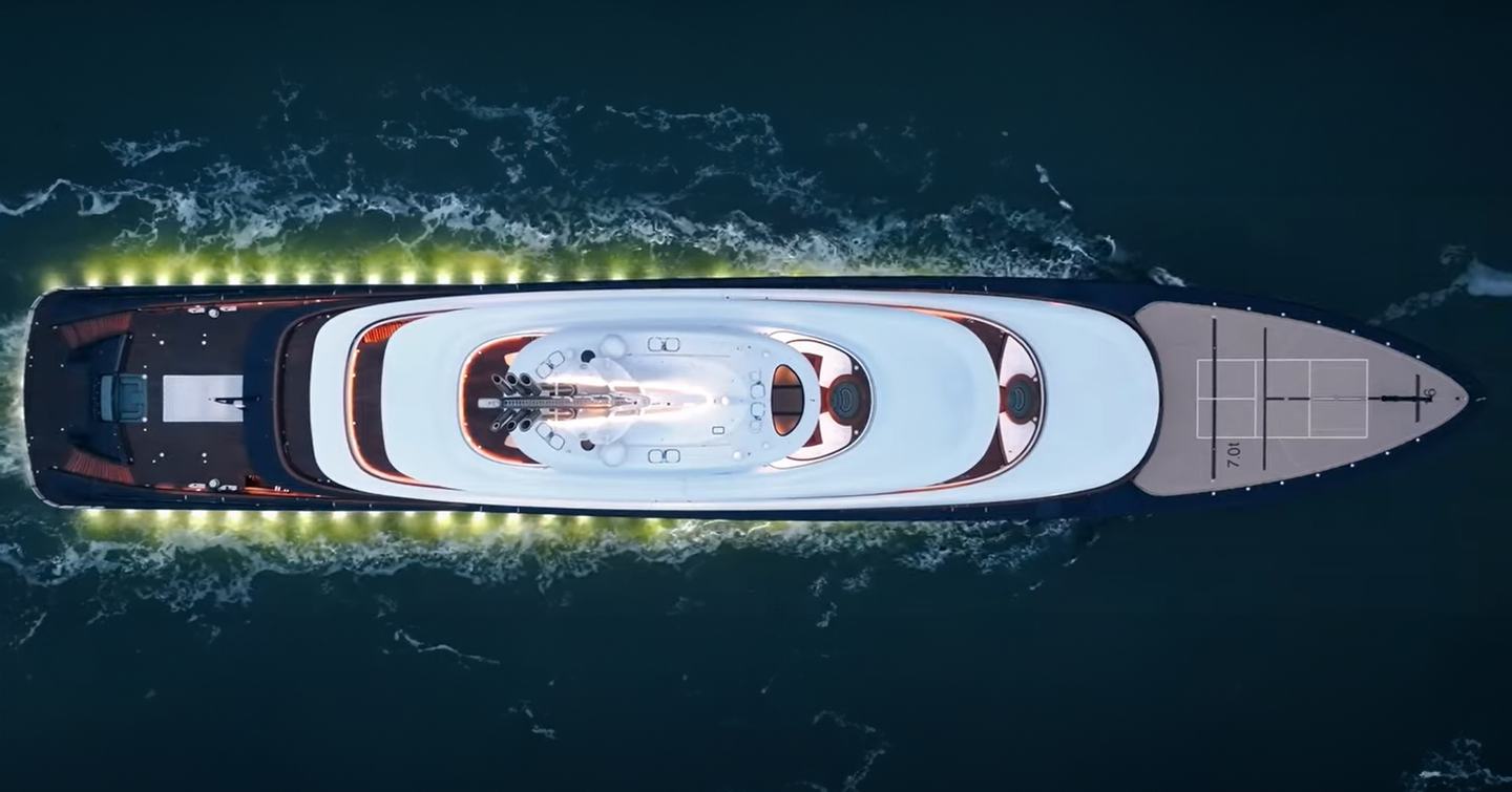 An aerial shot of Feadship Project 821 showing its tennis court on the foredeck