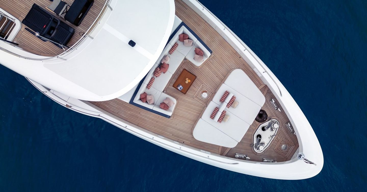 Birds-eye shot of Superyacht A+'s foredeck with u-shaped seating and sunpads