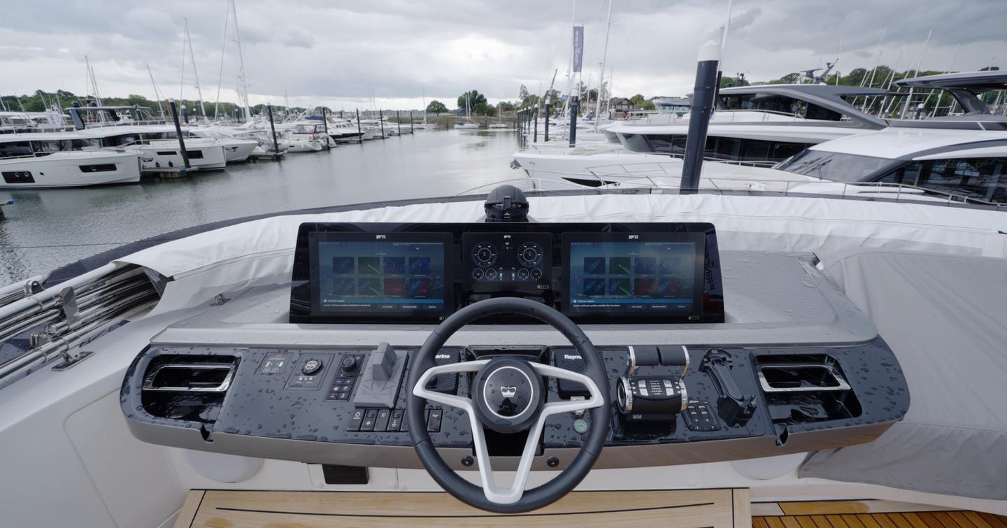 Princess S65 Mk2 sportsbridge helm station with twin navigation displays, wheel and engine controls