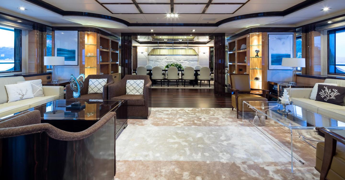 Vision's main salon, with dark furnishings and spacious dining area