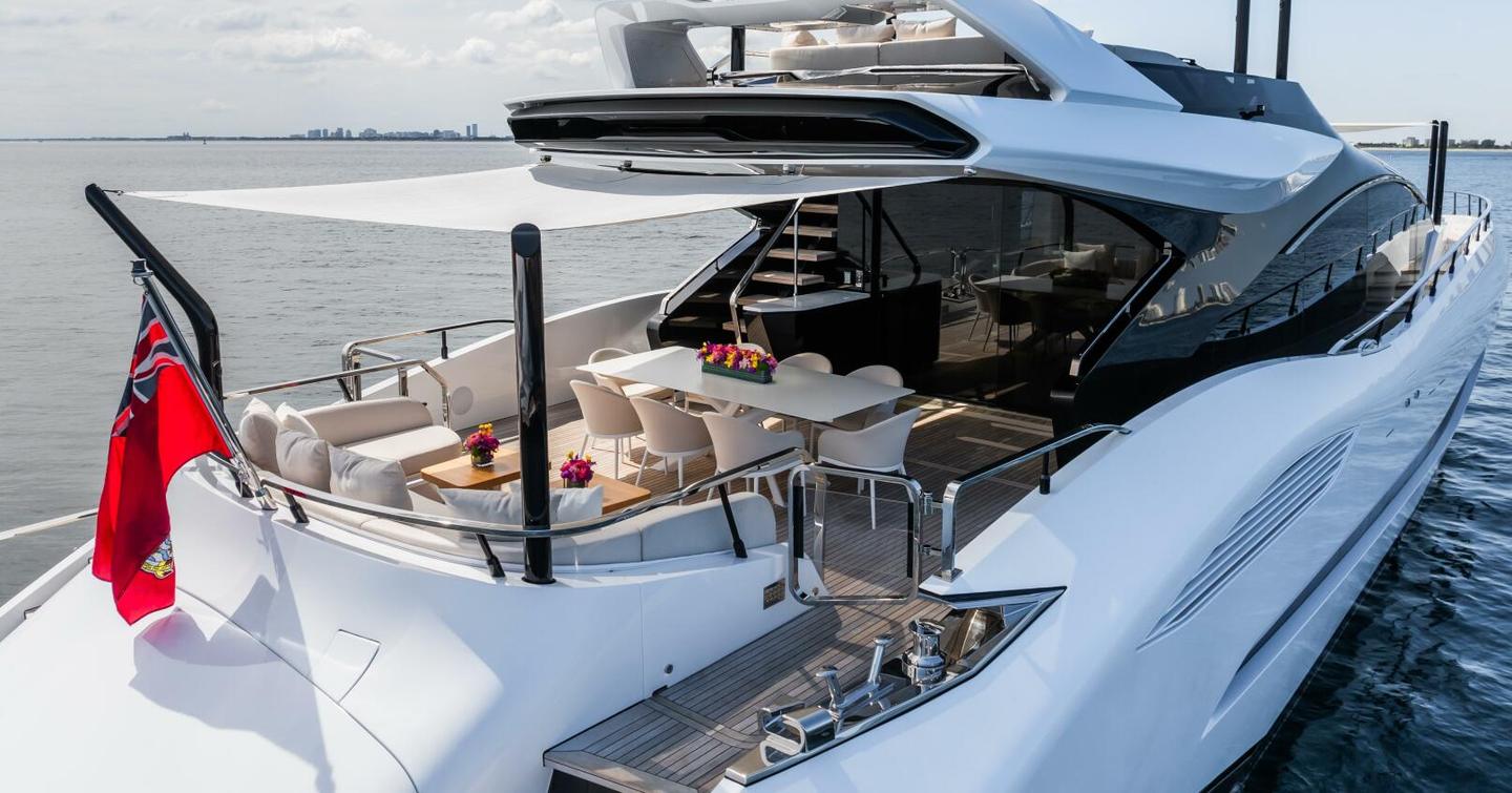 Motor Yacht Jacqpot aft deck with alfresco dining and U-shaped seating