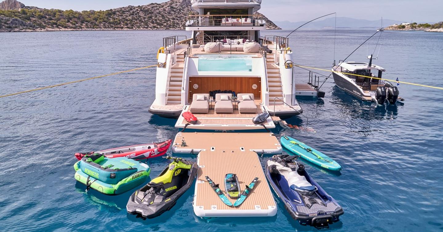 Superyacht Para Bellum beach club surrounded by tenders and toys 