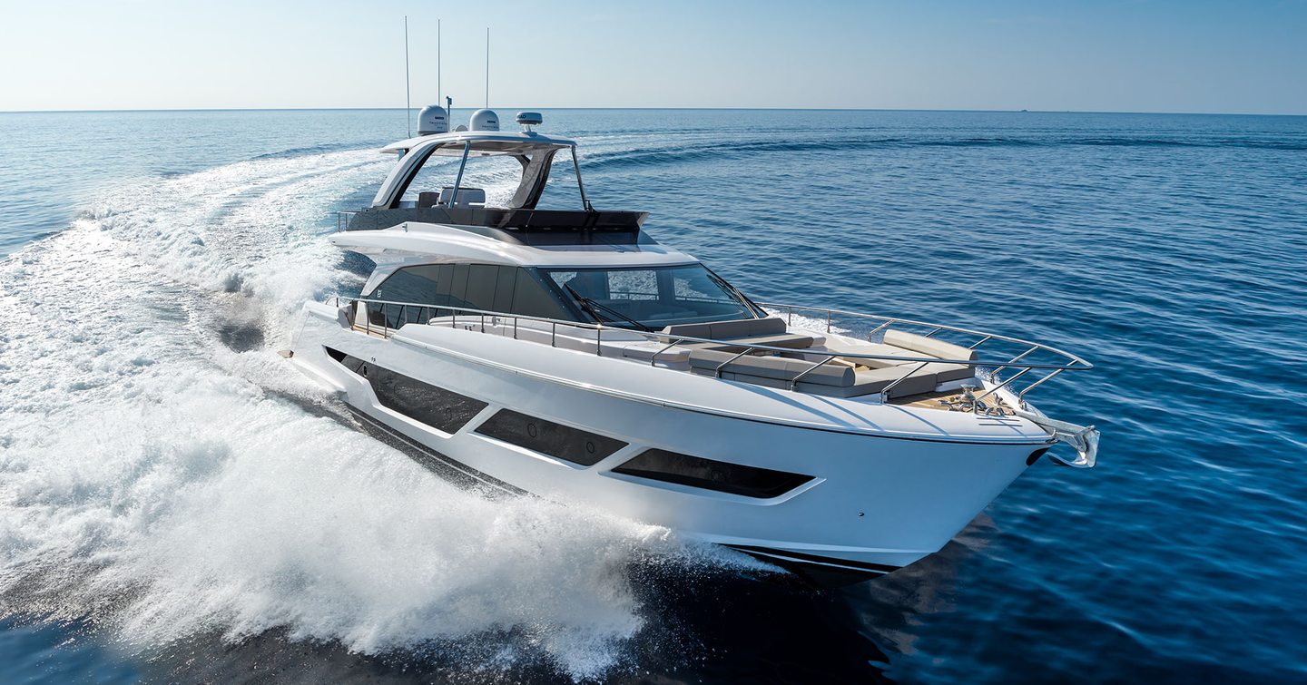 Ferretti 670 running through a calm blue sea