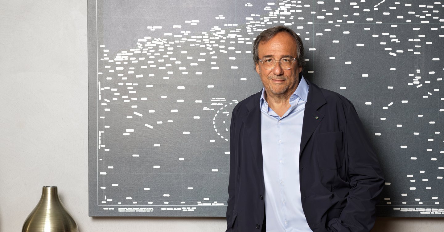 Massimo Perotti leaning against a cabinet