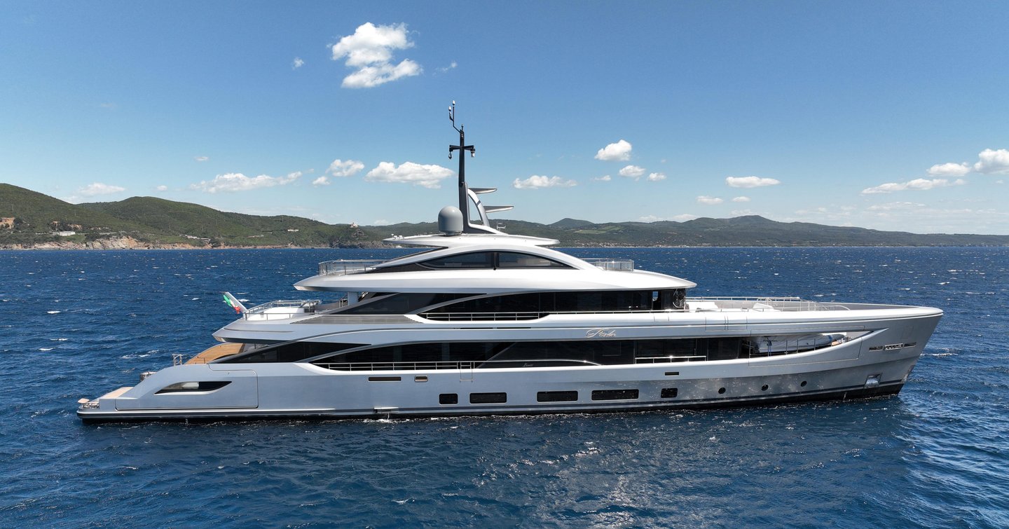 Motor yacht Perla at anchor on a fine day 