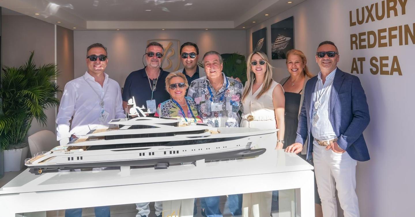Bilgin Team behind model of superyacht Project Bond at the 2026 palm beach international boat show