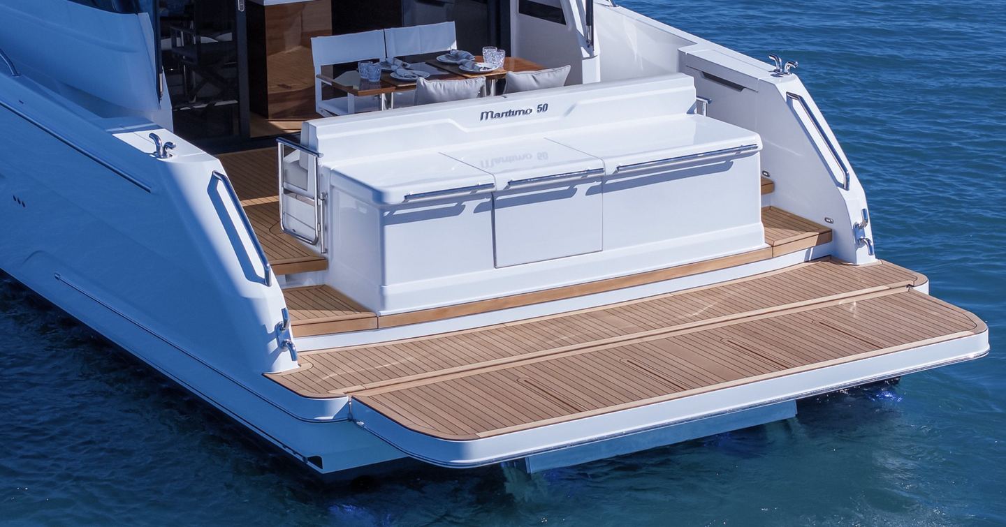 Maritimo M50 hydraulic bathing platform with teak decking and transom storage unit