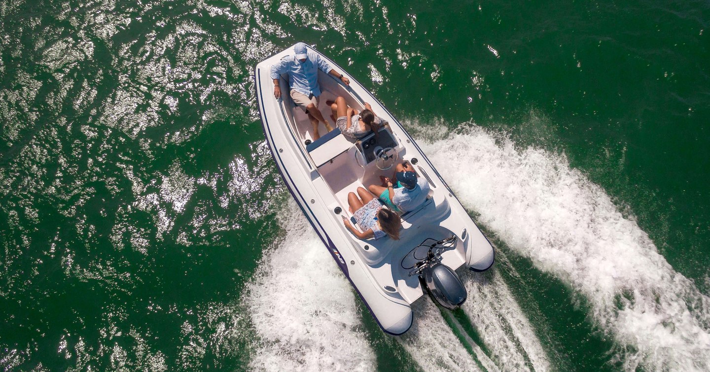 Four people on RIB tender viewed from above