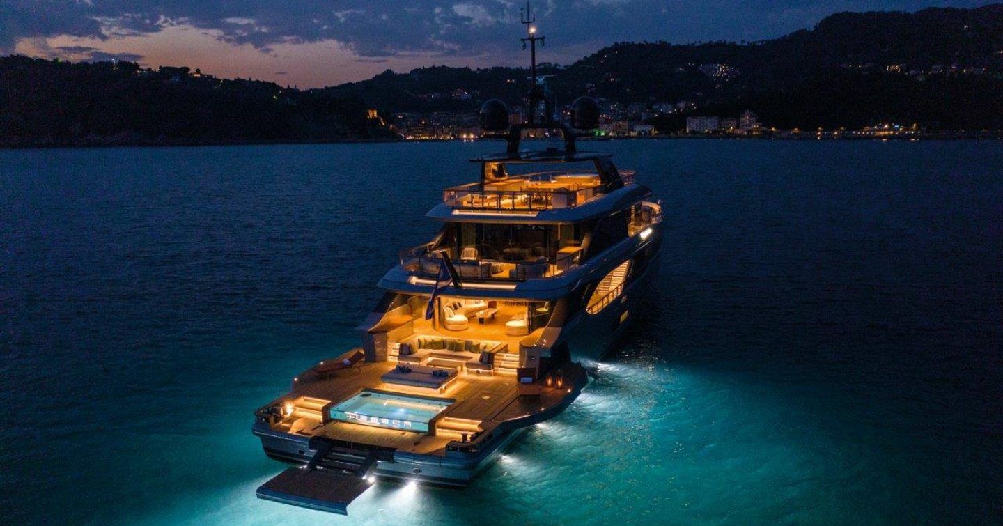 Benetti Oasis 40M lit up on water on night