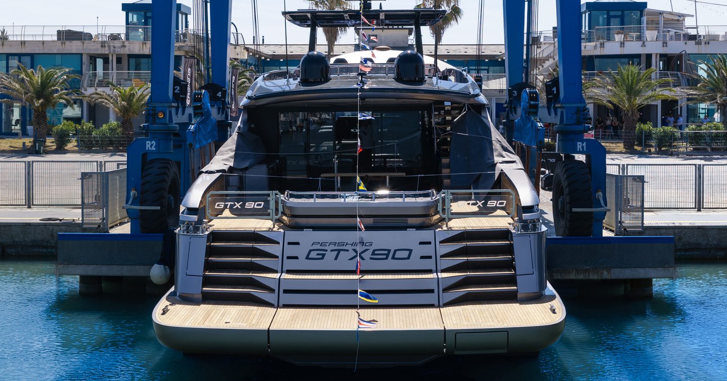 First Pershing GTX90 motor yacht at anchor stern view 