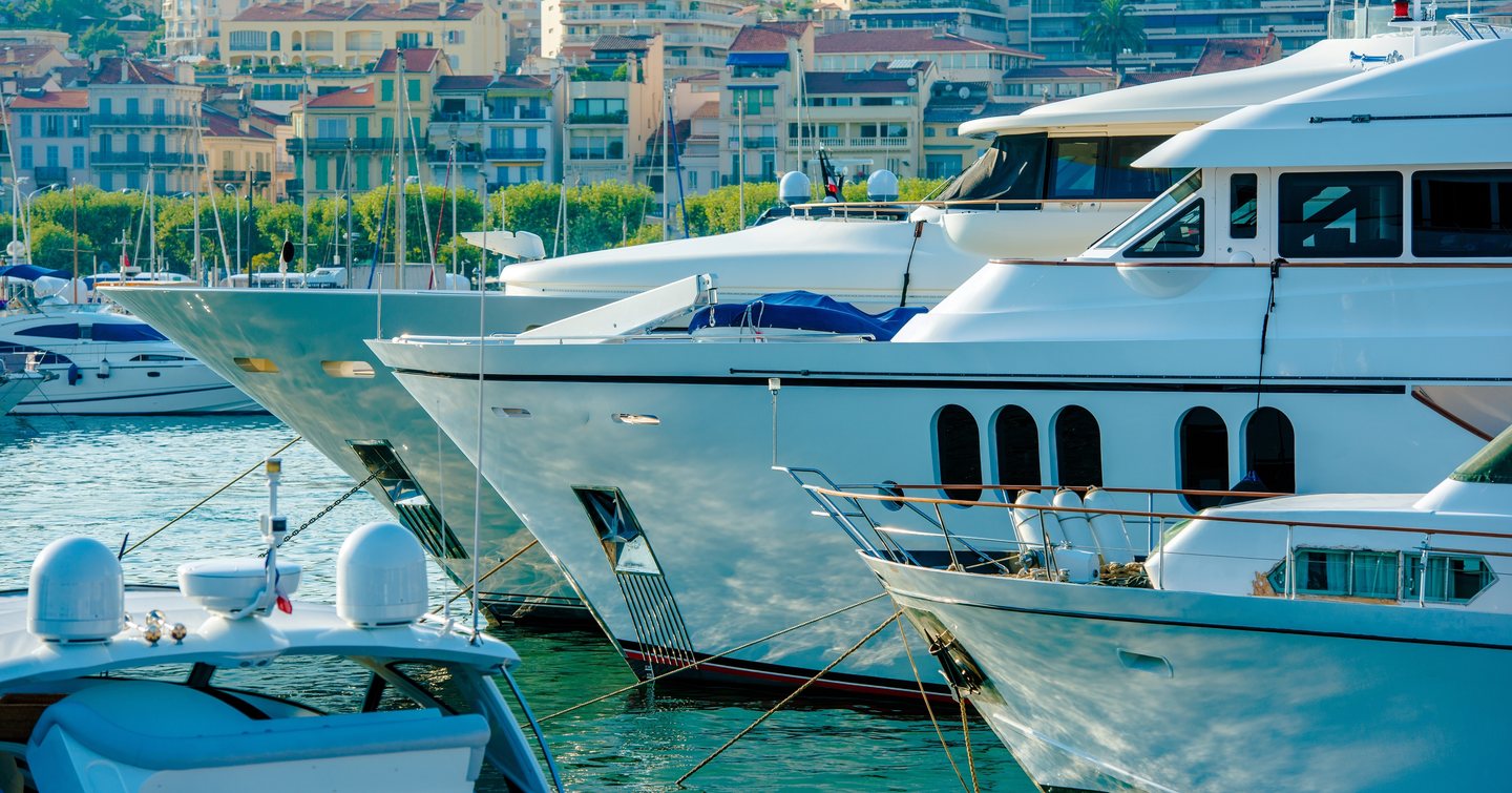 Yachts with Cannes coastline in background