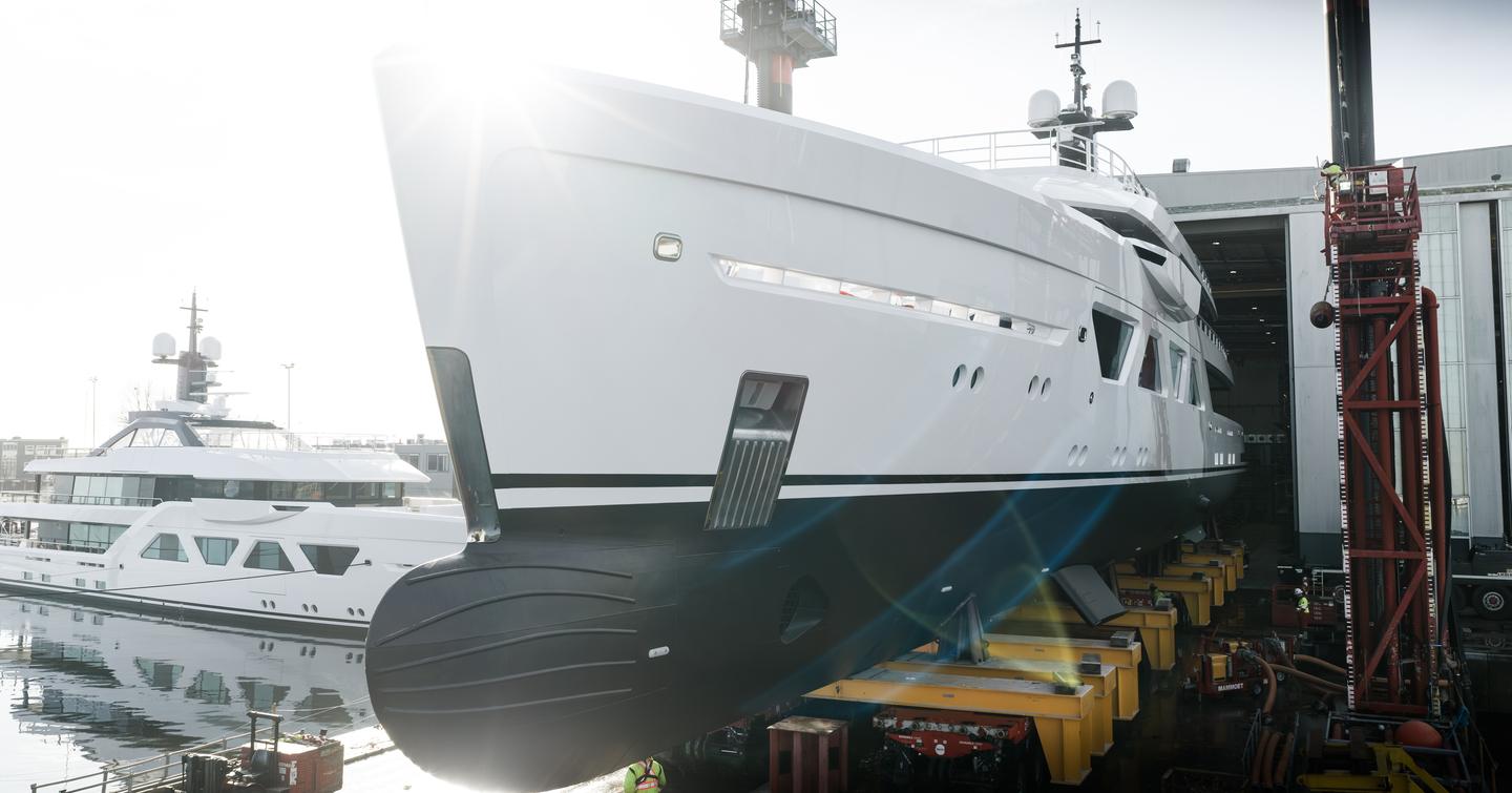 Close up of Amels 6009 superyacht  bow and bulbous bow area leaving shipyard before launch