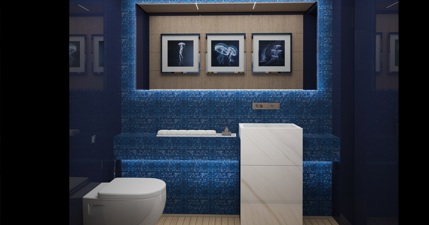 Bathroom in ISA Classic superyacht with blue tiling, white sink and toilet and three photos of jellyfish on the wall