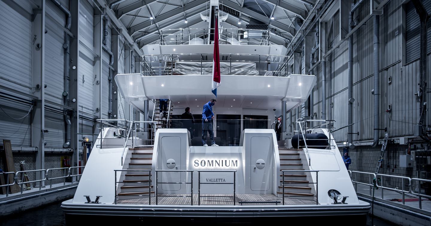 Superyacht SOMNIUM in the outfitting yard viewed from behind