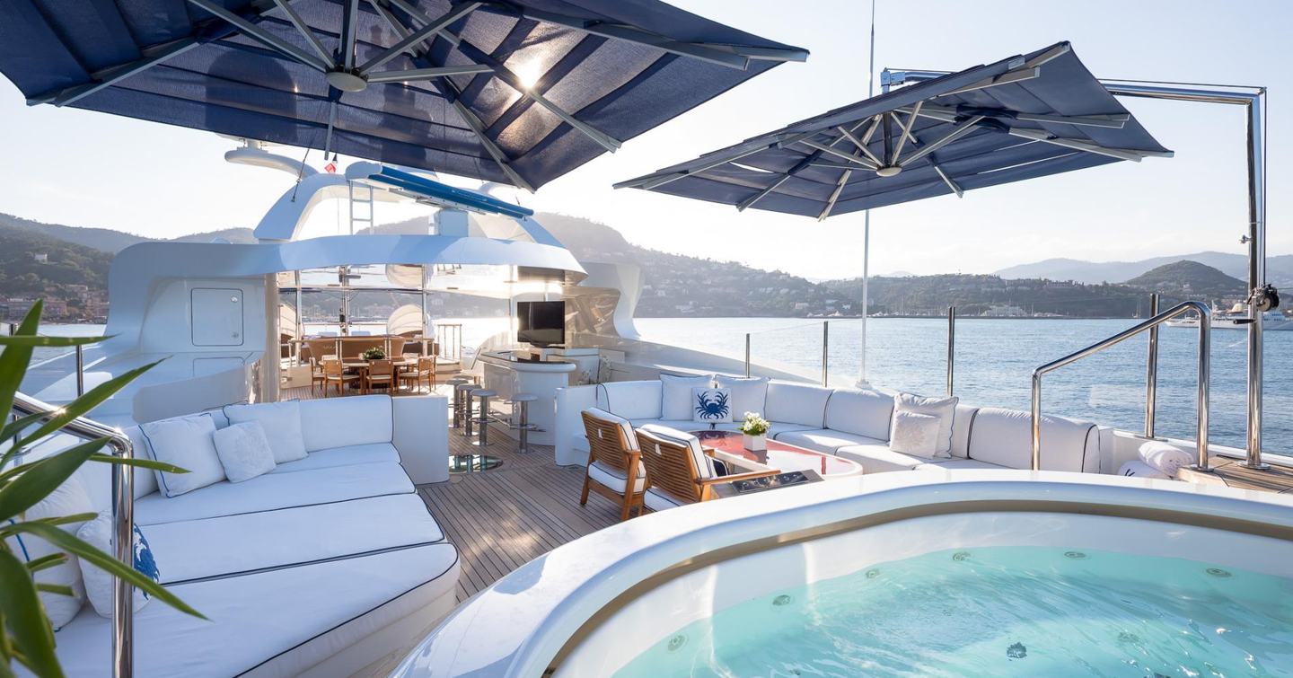 Superyacht Vision's sundeck with jacuzzi and lounging areas