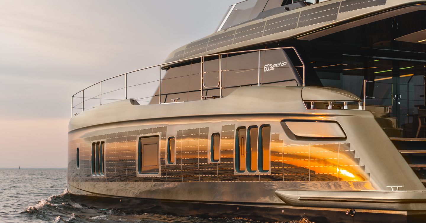 Sunreef Yachts Power ECO 60  shown at water level along port side profile, sunset shot with light highlighting the solar panels