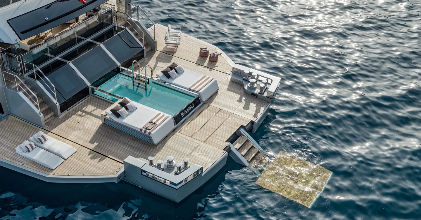 Motor Yacht Sairu stern with infinity pool and surrounding sunpads 