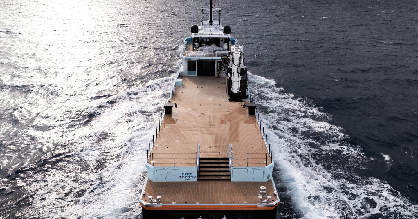 Stern shot of Support yacht Five Oceans under way