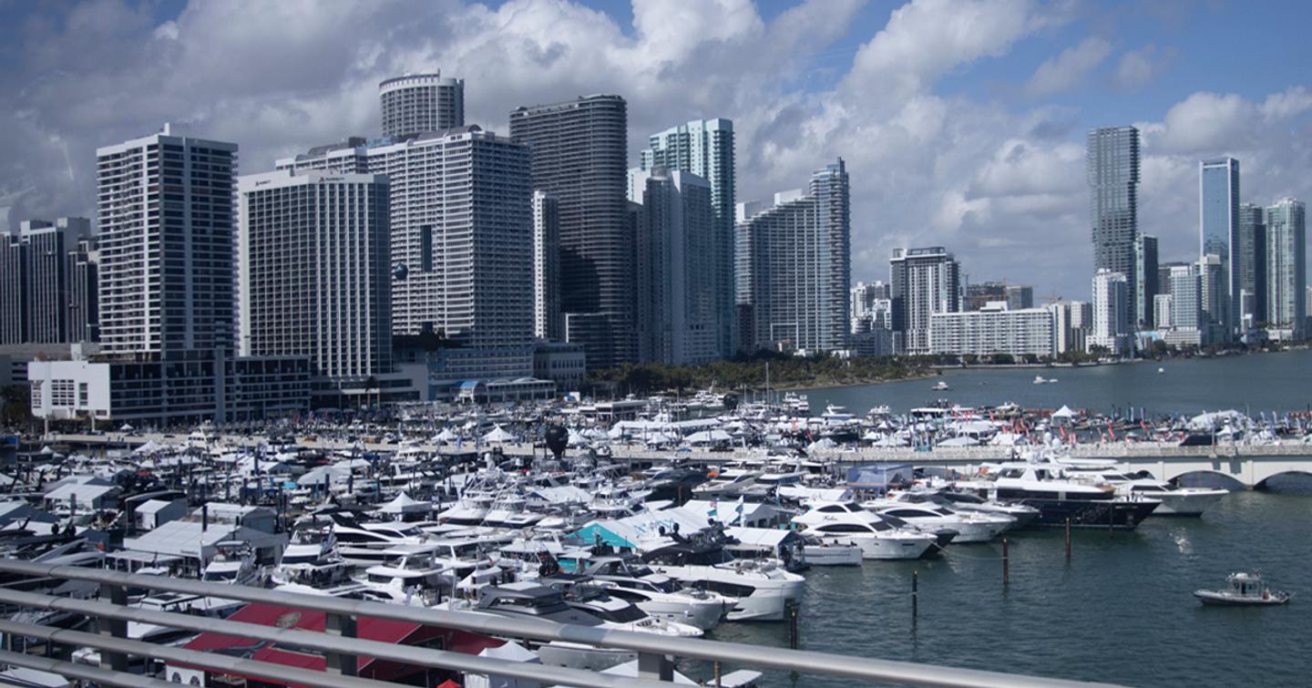 Overview of the Miami International Boat Show, with many motor yachts berthed in the marina