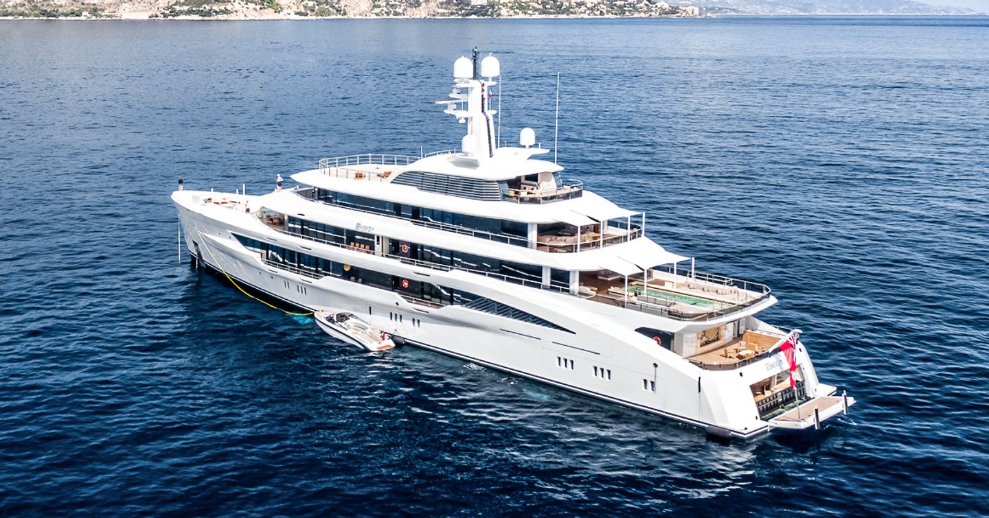 Superyacht Energy at anchor in front of a mountain