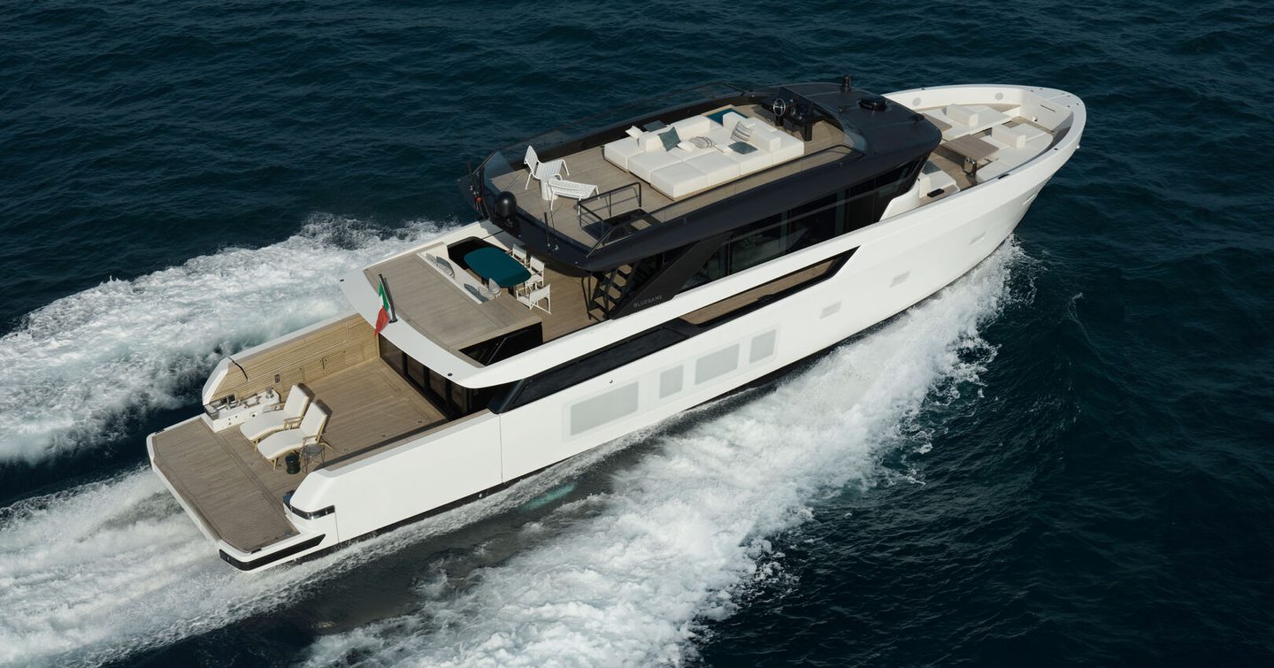 Bluegame BGX83 motor yacht underway stern view 