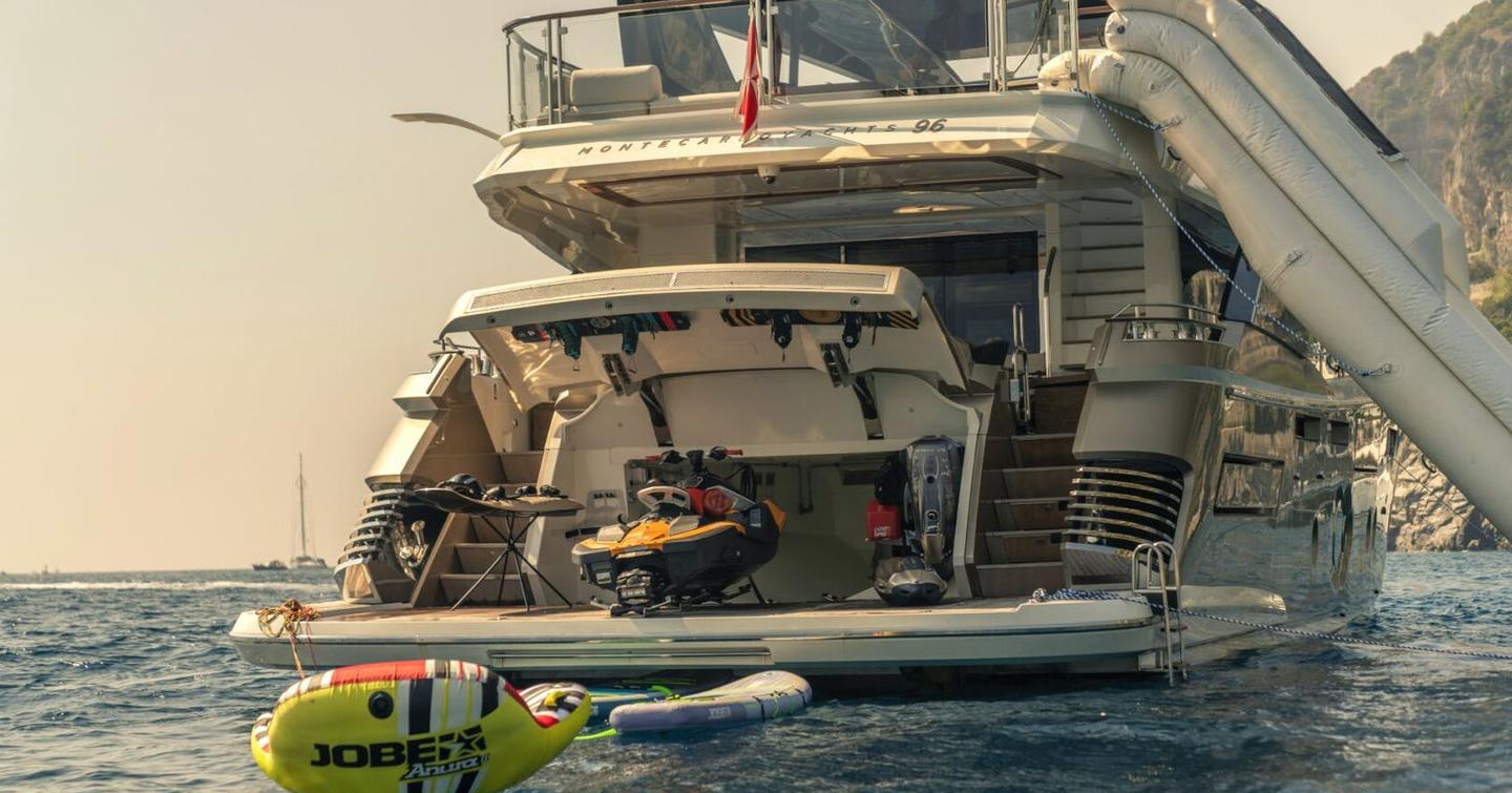 Motor Yacht Vivaldi's aft with inflatable slide and tenders