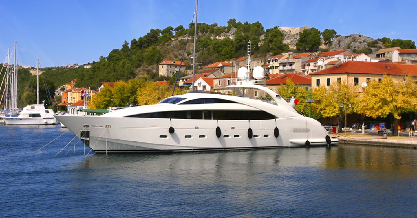 Side view of a yacht moored at a marina  
