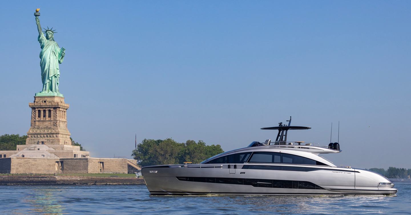 Pershing GTX80 motor yacht adjacent to the Statue of Liberty