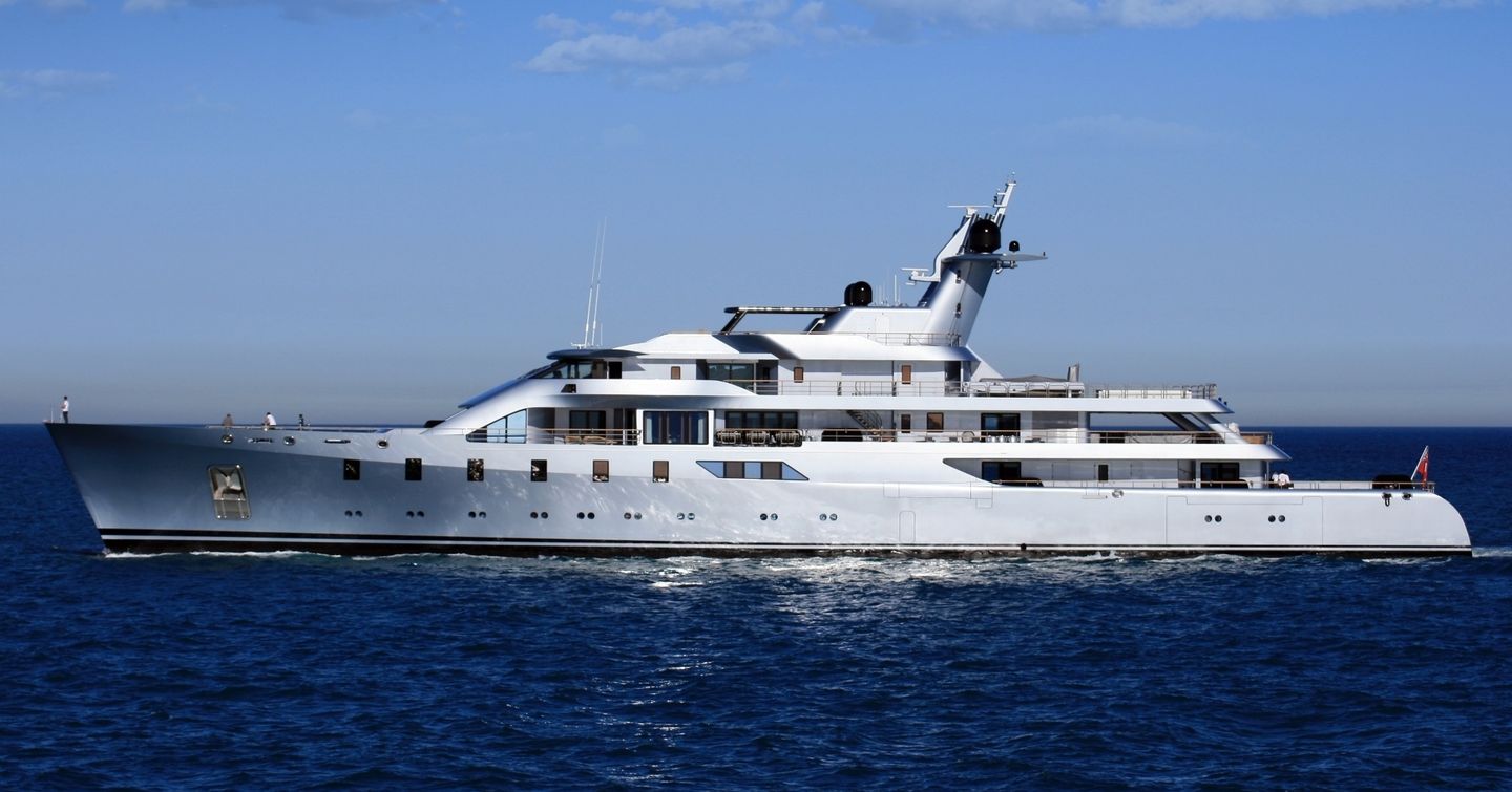 The PACIFIC X superyacht showing off her portside amid a deep blue sea