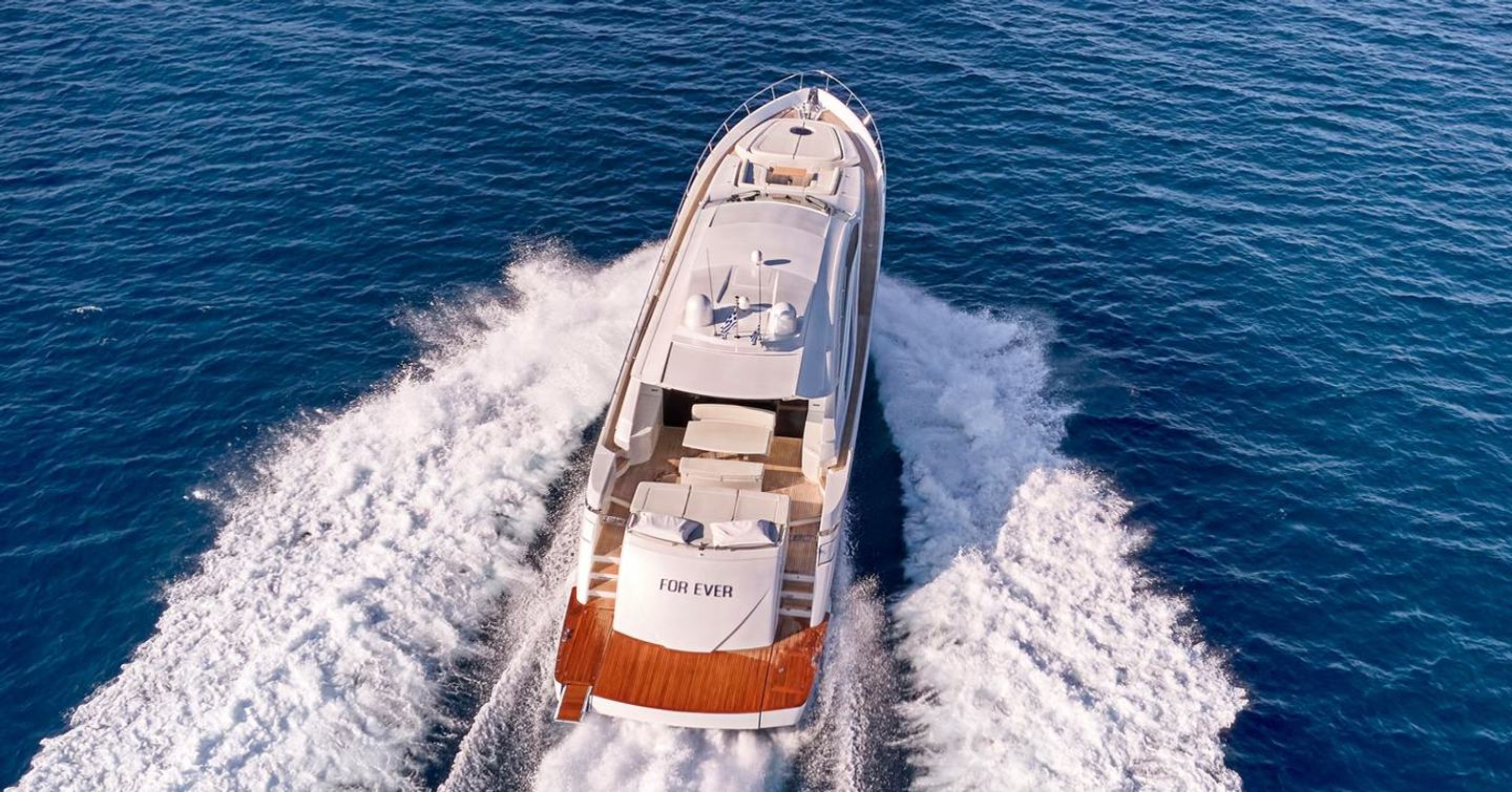 Pershing motor yacht For Ever underway stern view 