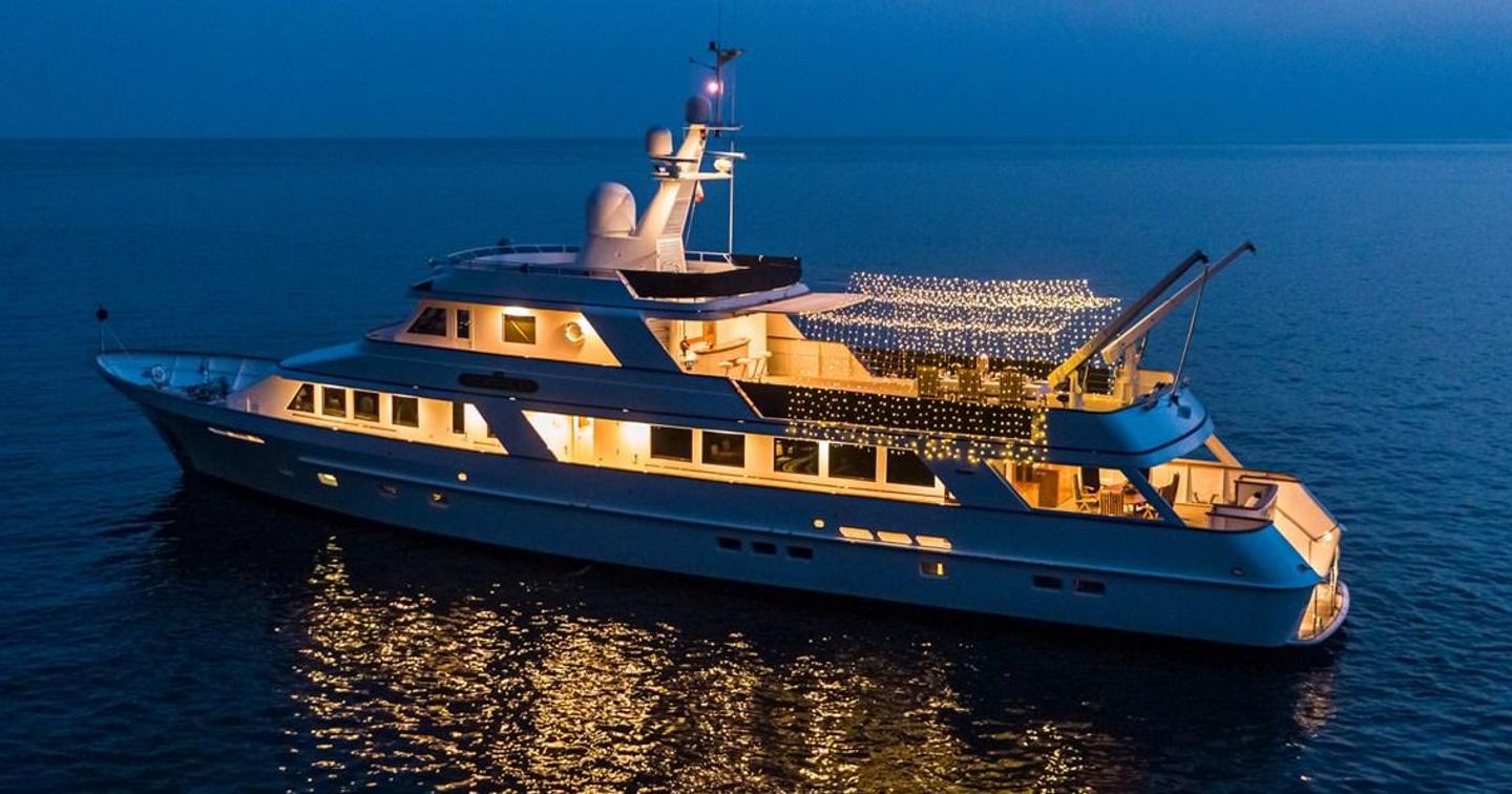 Monaco at anchor at night with lights
