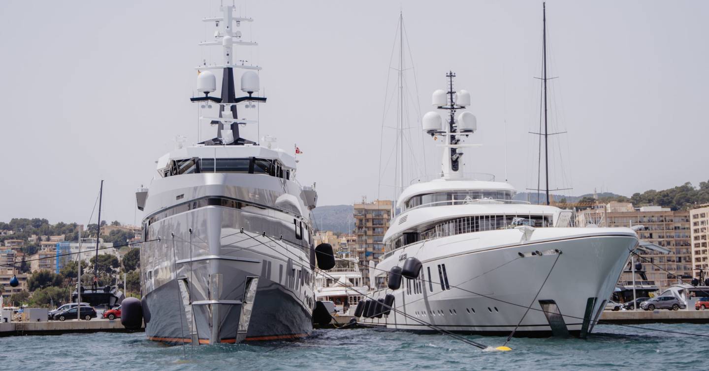 Two superyachts berthed in Marina Moll Vell