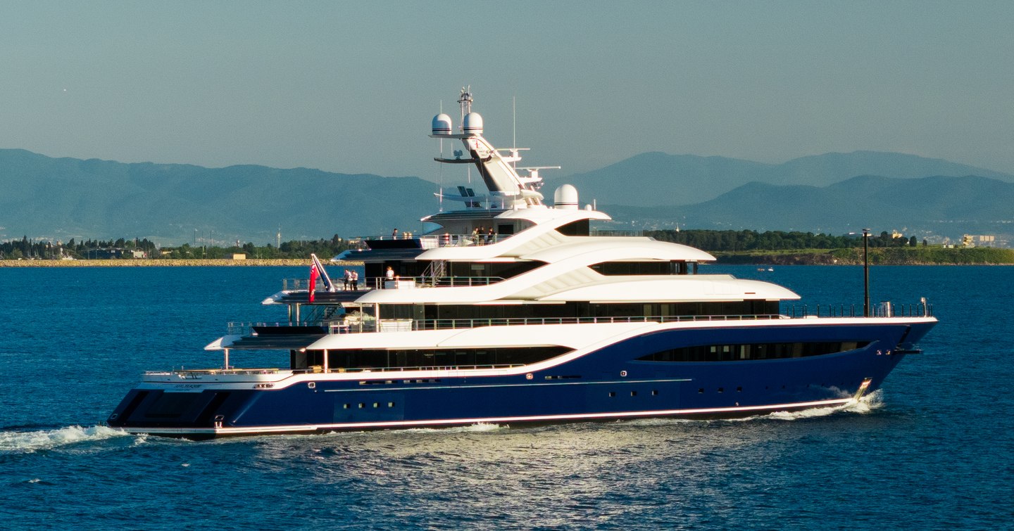 Turquoise superyacht Angelique underway side view 