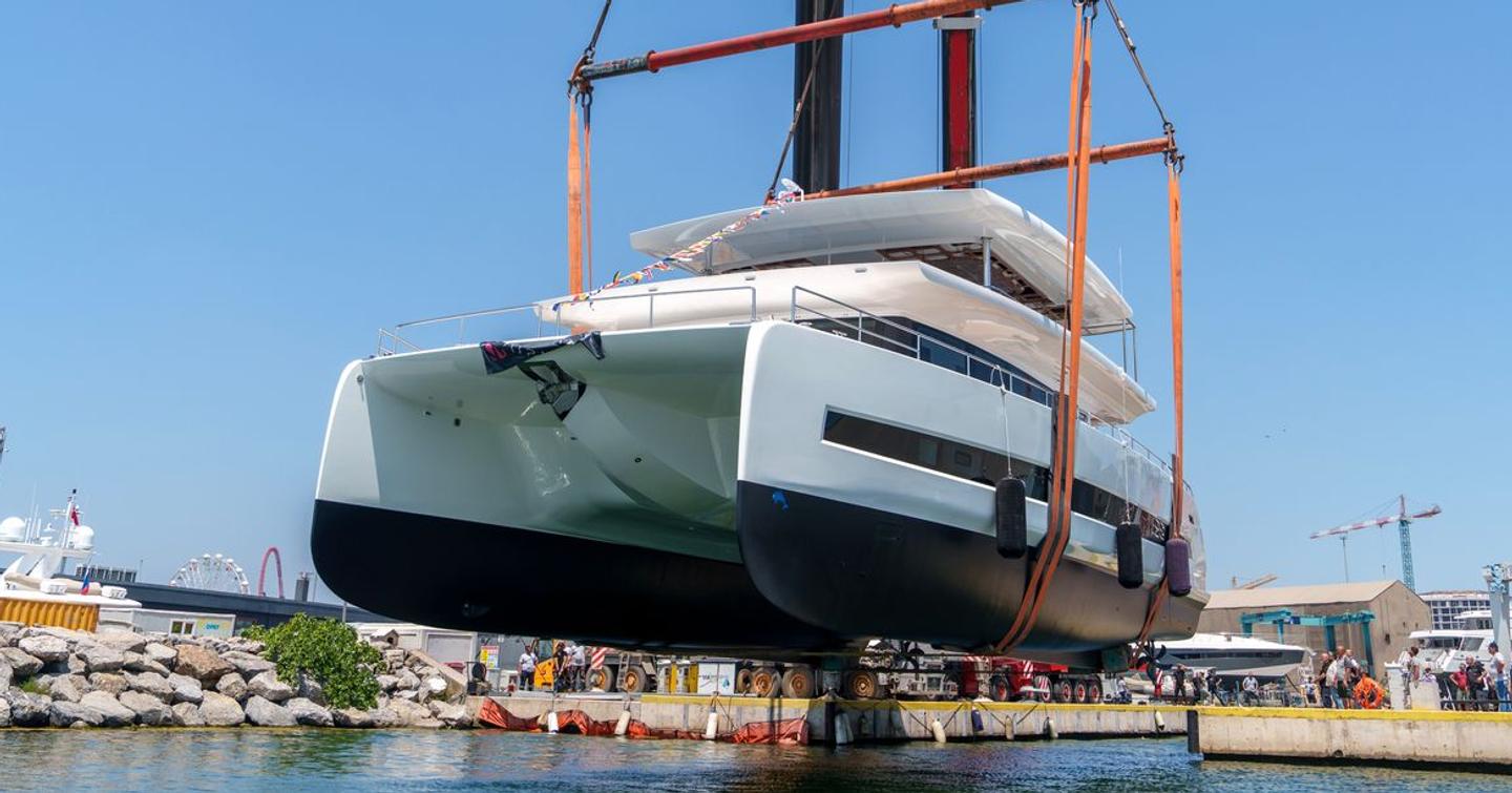 Second VisionF E-Cat 80 catamaran being lowered into water at launch