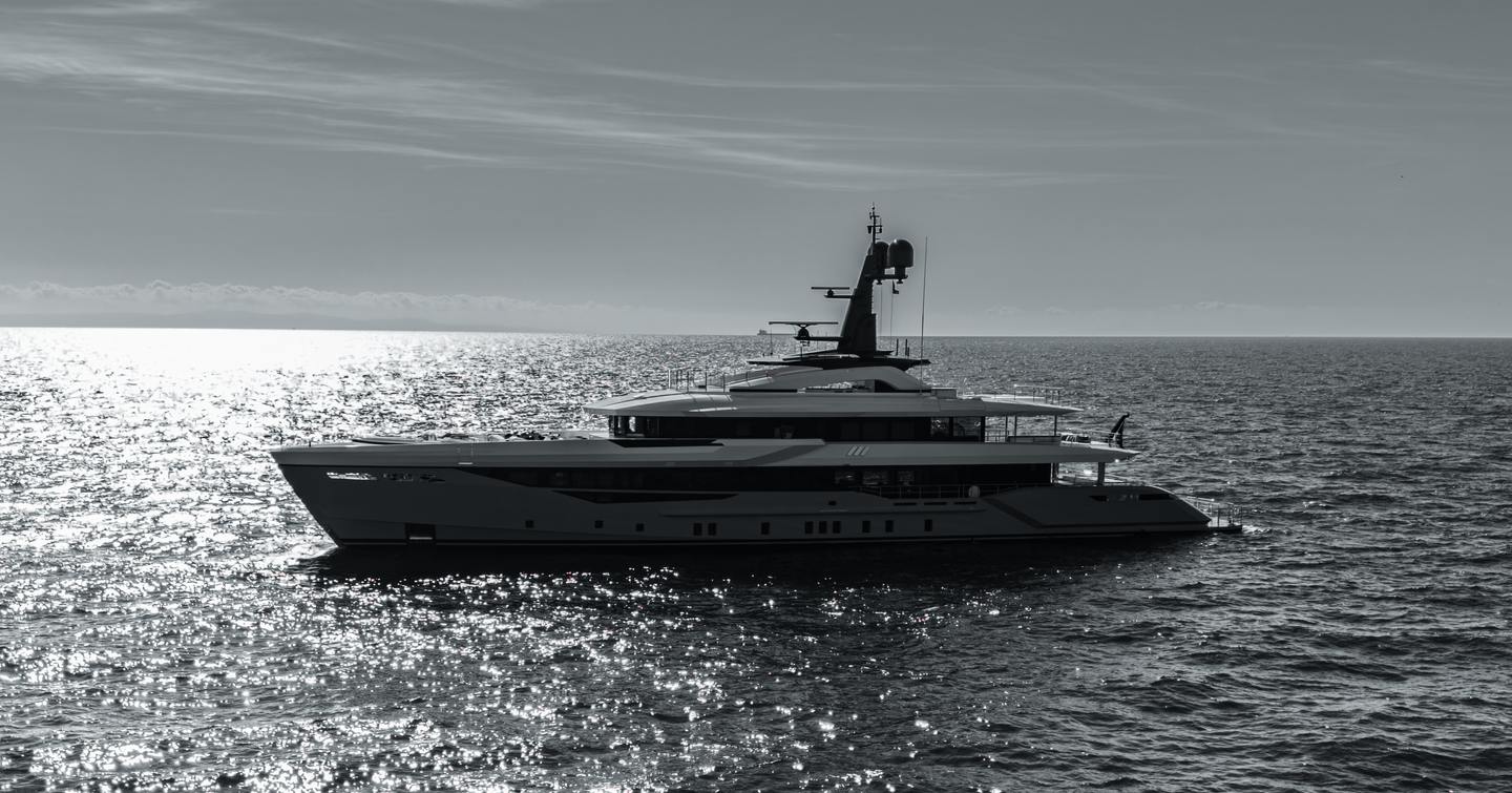 Bilgin 170 Superyacht Tamasha on calm sea in black and white 