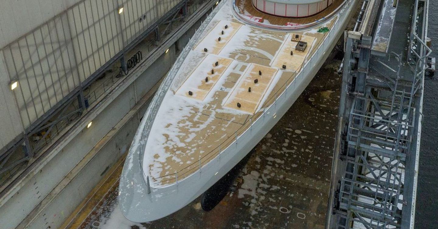Close up of 102m Lürssen Superyacht Jassi foredeck and helipad inside floating shed 