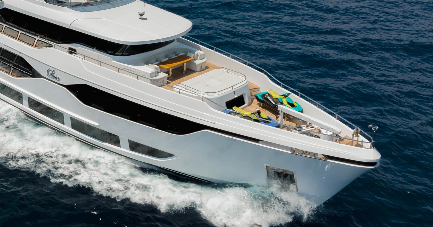 Superyacht Olivia foredeck with U-shaped seating and tender storage