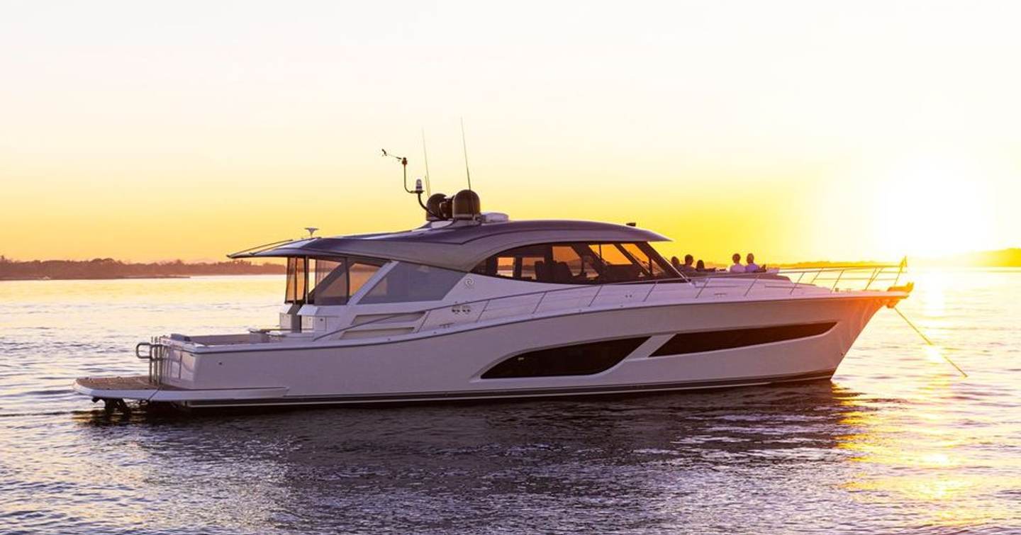 Riviera 645 SUV Series II motor yacht at anchor side view 
