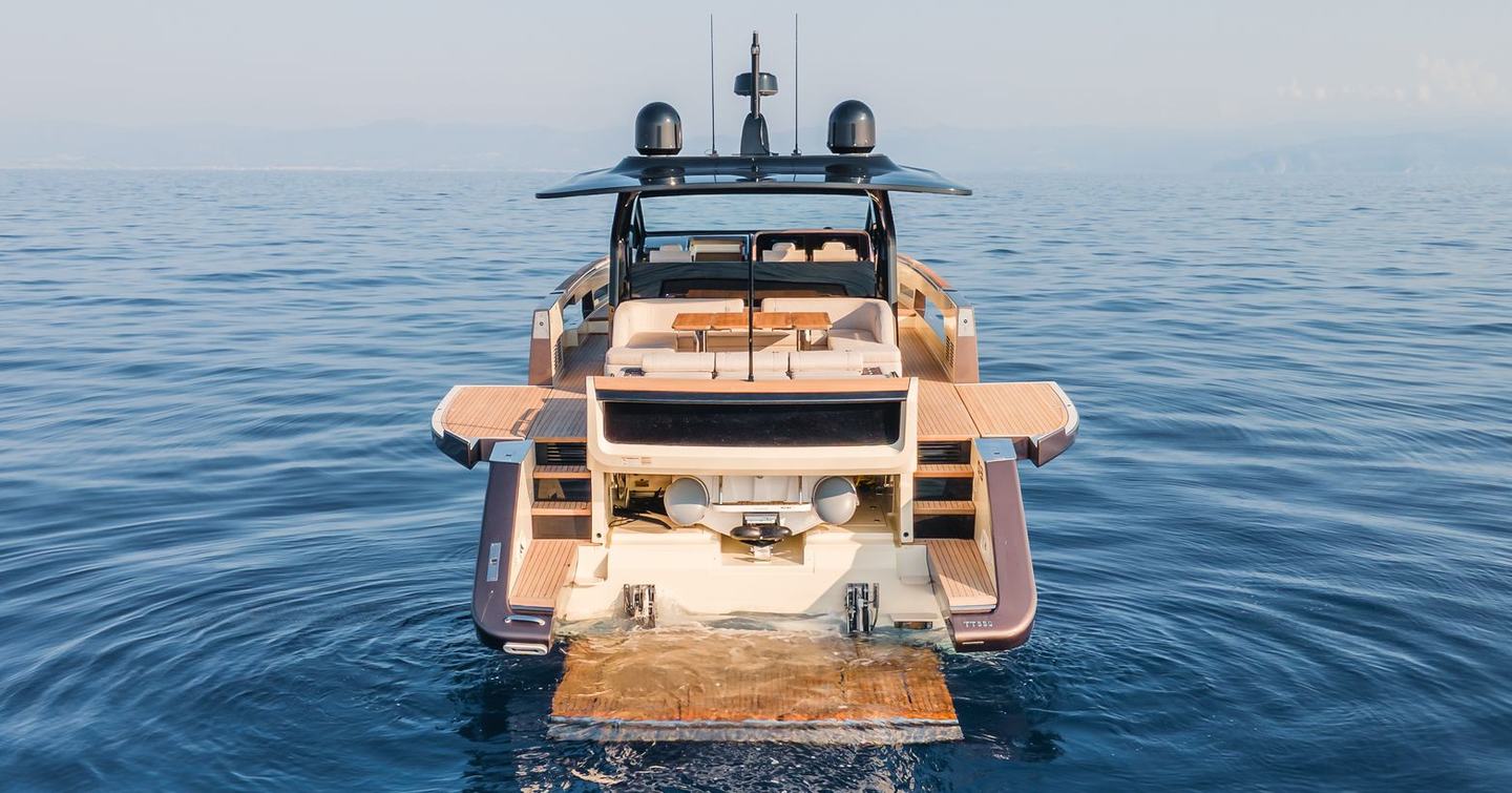 Invictus TT550 motor yacht aft decks and hydraulic stern at anchor