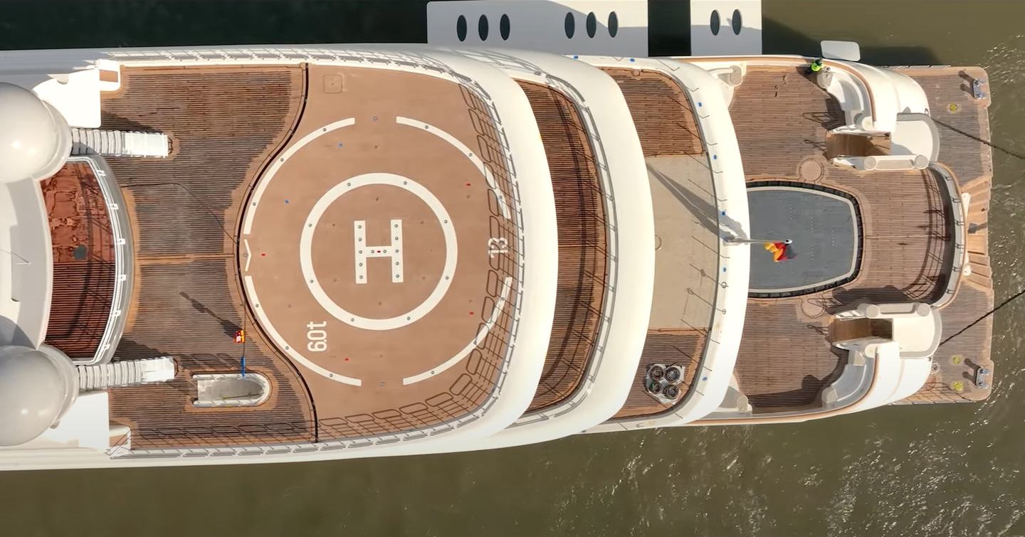 Bird's eye view looking down on stern of Superyacht OPERA. Helipad visible with aft decks and an empty pool below.