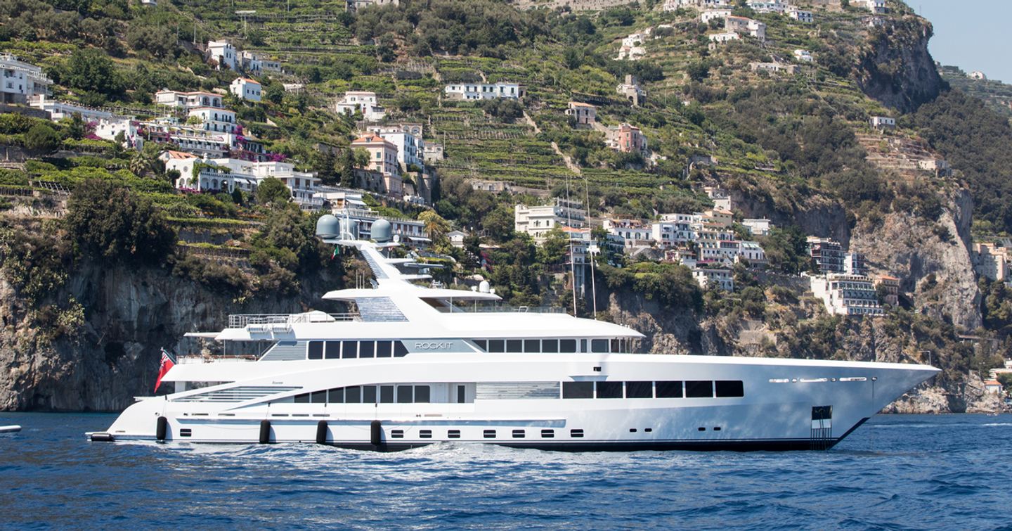 Superyacht at anchor side view 
