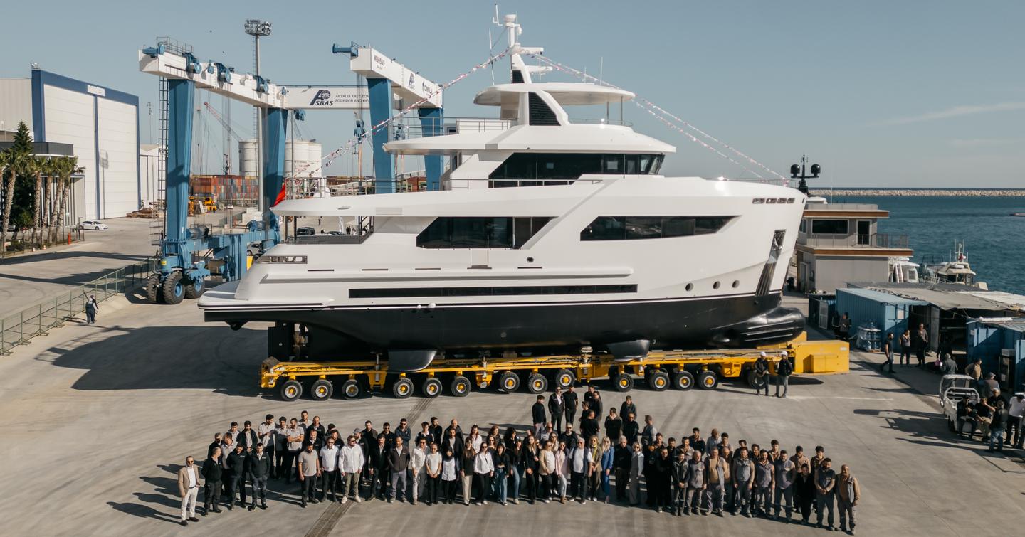 Shipyard team in front of Bering 88 expedition yacht Sayna at launch ceremony