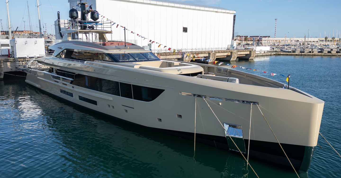 Tankoa motor yacht Rilassata at anchor adjacent to construction sheds