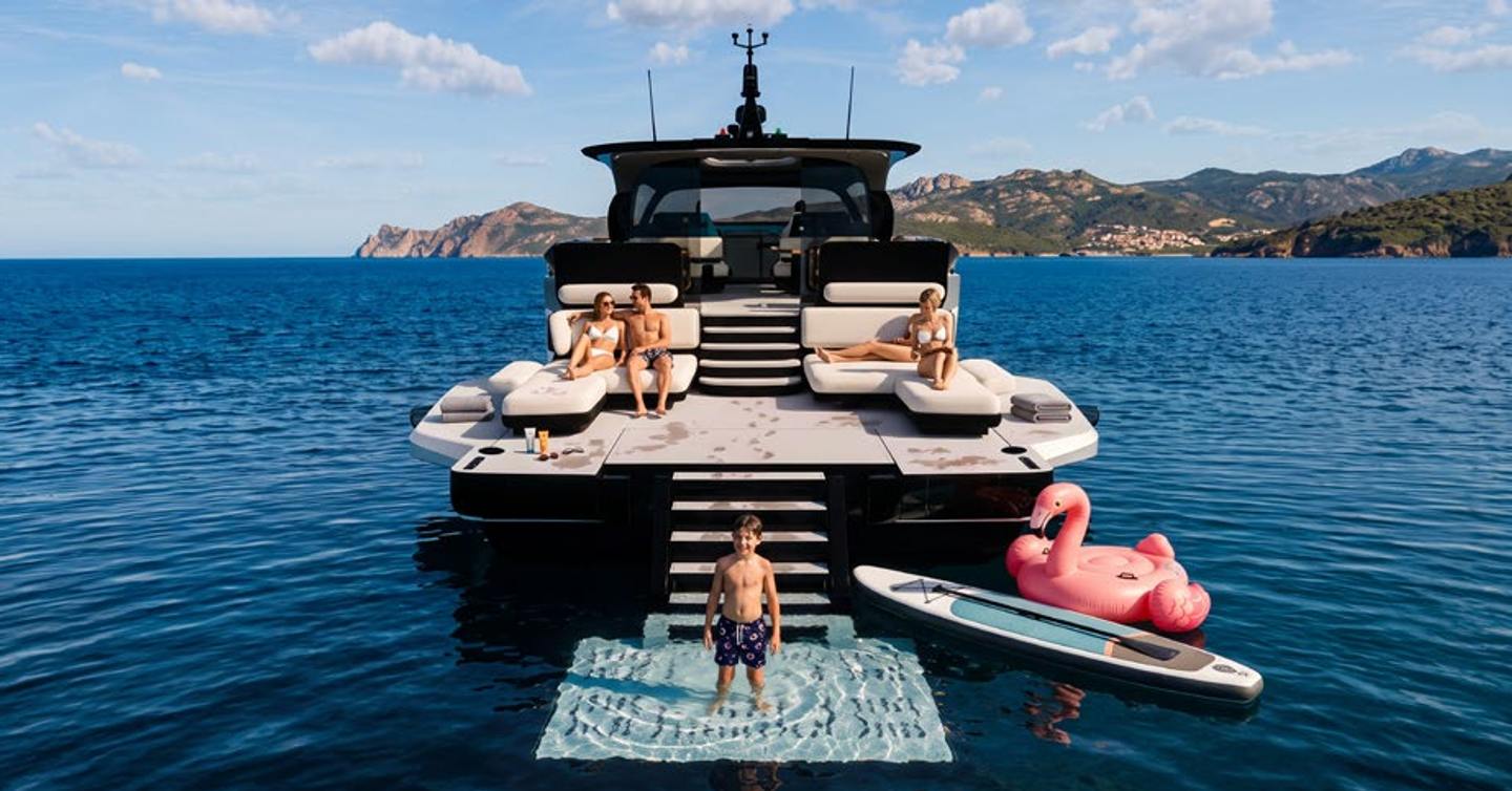 Rendering of ICONA 70 motor yacht stern with steps into water and family relaxing on aft